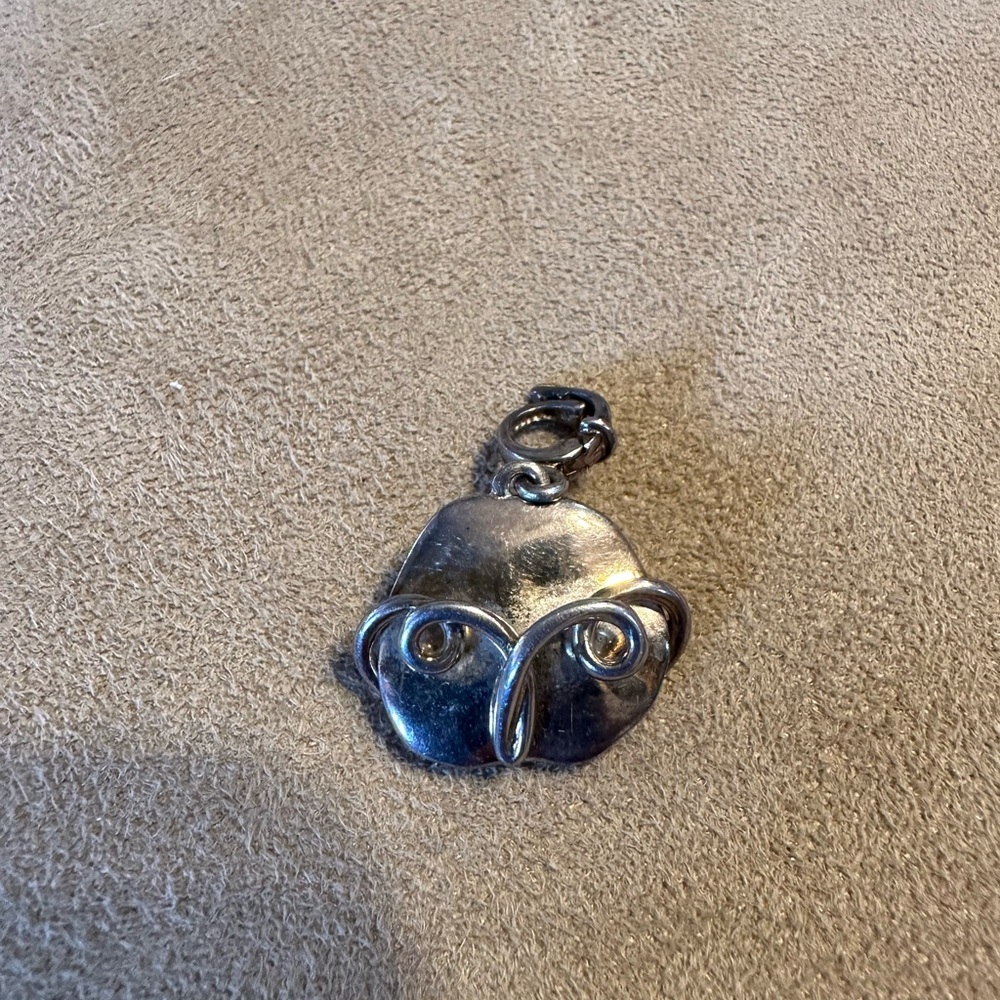 Artsy sterling silver face pendant